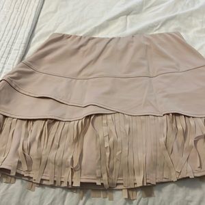 Really cute tan fringed tennis skirt.